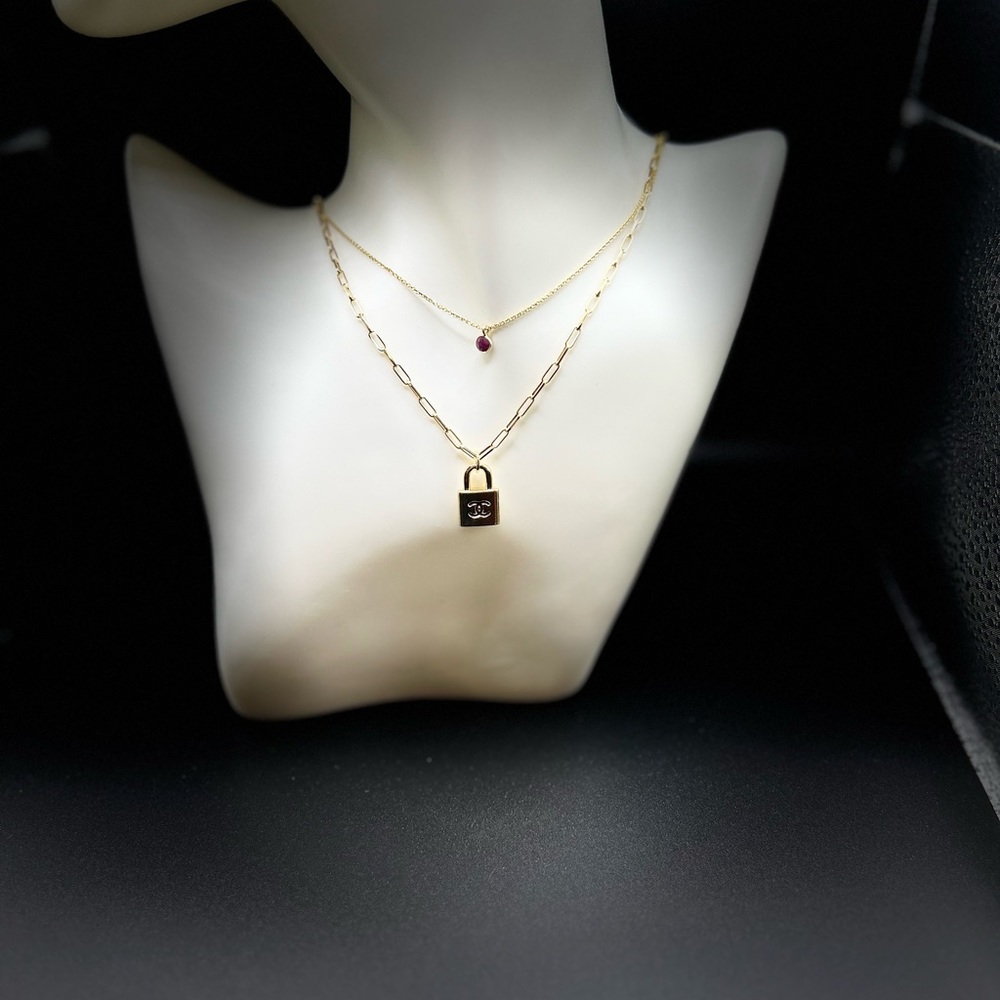 1 pre loved zipper pull charm on an 18kt gold plated 925 silver neckl…